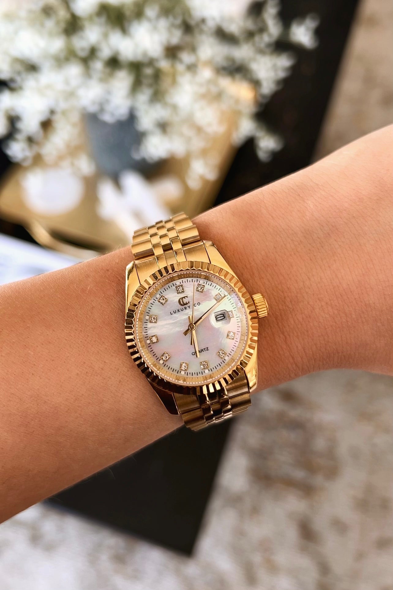 Gold watch with mother of pearl face deals
